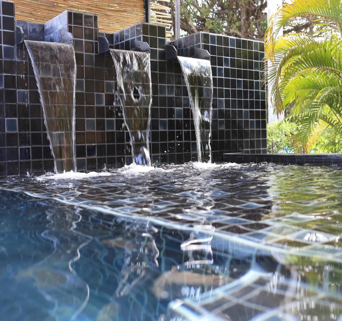 Waterfall flowing into dark pool.